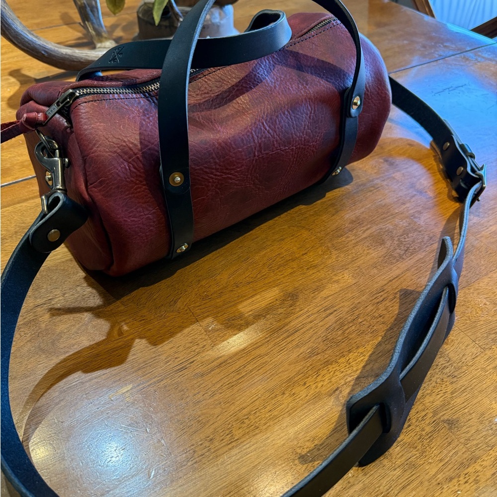 Go Forth Goods: Stylish Wine Bison Jane bag: Dimensions 6” circle 12” wide.